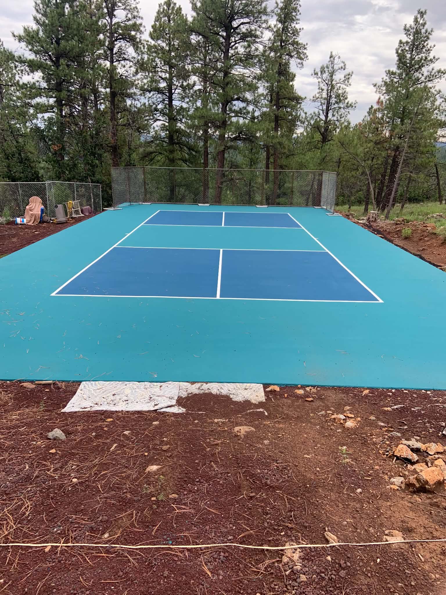 Concrete basketball and pickleball court completed by JH Concrete